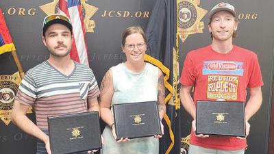 Jefferson County residents, from left, Vince Spinali, Ashley Chapman and Riley Wood received citizen commendations for their actions that helped lead to the arrest of a woman suspected of striking and killing a motorcycle rider with an SUV she was driving.