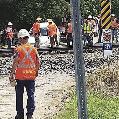 PHOTO: The front wheels of this car fell off the road and into a shallow hole where road repairs were being made. (Submitted)