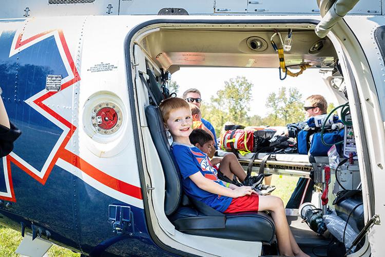 Wyatt Lovejoy, 5, of Festus gets comfortable in the LifeNet Farmington rescue helicopter.