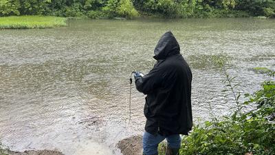 A team member from the Missouri Department of Natural Resources’ Southeast Regional Office’s Wastewater Unit takes water samples Aug. 6 near the Leadwood wastewater treatment facility’s outfall on the Big River.