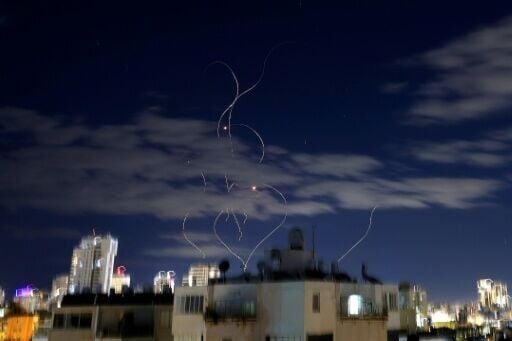 Rocket trails in the sky above the Israeli city of Netanya amid a fresh Iranian missile barrage