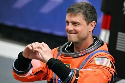 NASA astronaut Reid Wiseman gestured a heart sign before the Artemis II took off to orbit the Moon, where astronauts proposed for a crater to be named "Carroll" in honor of his deceased wife