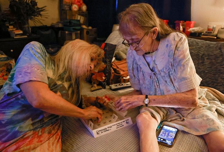 Dorothy White, right, and her daughter Sonia Staires organize her weekly pill box