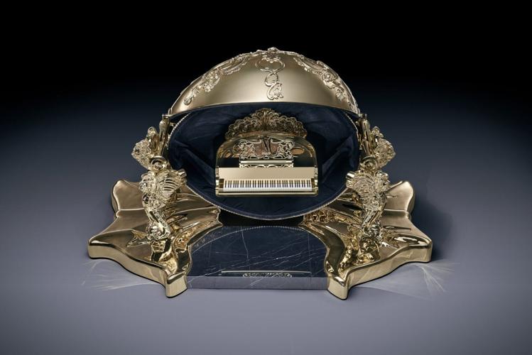Cambridge firm creates golden egg that opens to reveal grand piano