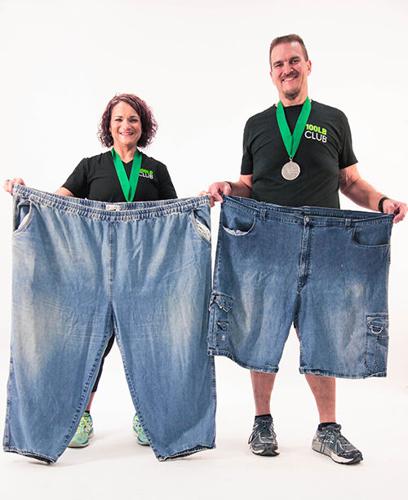 Mike and Lynn Kirn of Imperial with the pants they wore before losing nearly 400 pounds between them.