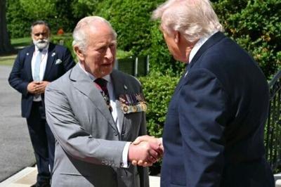 US President Donald Trump shakes hands with Britain's King Charles III as he hosts him for a formal farewell