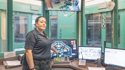 Corrections officer Amy Luebbers in the control room of the Jefferson County Jail in Hillsboro.