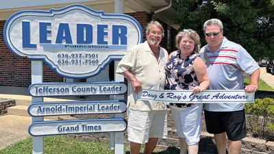 From left, Roy Evans, Leader Publisher Peggy Scott and Doug Reuther during the Doug and Roy’s Great Adventure caravan stop at the Leader office in Festus Saturday.