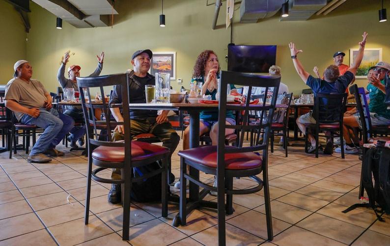 Patrons yell as the TVs turn off during the match