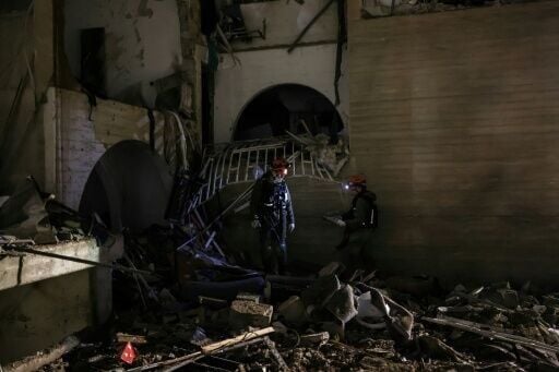 AFP footage from Arad showed rescue workers sifting through rubble
