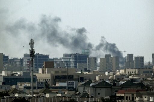 A plume of smoke rises over buildings in Doha, Qatar on March 5