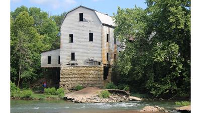 The Cedar Hill Mill, which sits on the Big River at 8460 Wolf Road, is approved for rezoning and a parking lot by the P and Z commission.