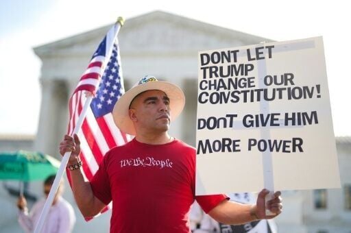 Michael Martinez demonstrates outside the US Supreme Court ahead of the birthright case