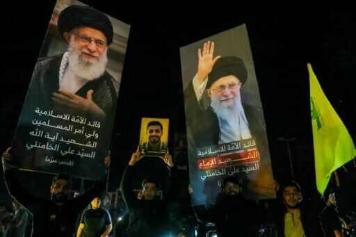 Supporters of Hezbollah in Beirut hold portraits of assassinated Iranian Supreme Leader Ayatollah Khamenei while celebrating the ceasefire with Israel as it takes effect