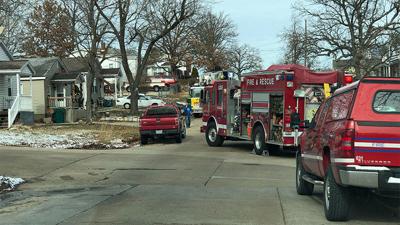 Firefighters respond to a De Soto home that was damaged by a fire that started in the attic.