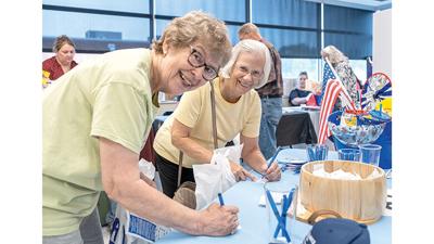 Cousins Jean Govro of Herculaneum and Jeri Rider of Pevely sign up for a drawing with one of the vendors at the 2024 Festus Senior Expo. This year's expo will be at the Jefferson County YMCA, 1303 YMCA Drive.