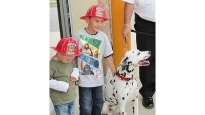 Two children attend a previous open house hosted by the Herculaneum Fire Department.