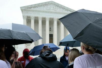 Demonstrators gather in front of the Supreme Court building on June 23, 2026, in Washington.