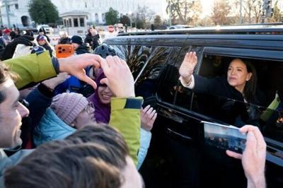 Venezuelan opposition leader Maria Corina Machado waves to supporters from her car as she departs the US Capitol after meeting with US senators on January 15, 2026
