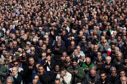 Muslims take part in Friday noon prayers at the compound of the Mosalla mosque in Tehran
