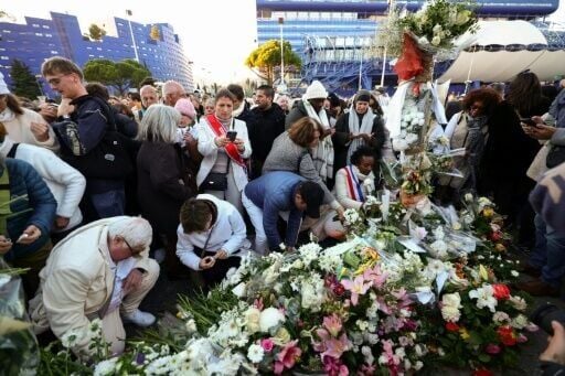 People layed flowers and lit candles in tribute to Mehdi Kessaci at the roundabout where he was murdered and to protest against drug trafficking, in Marseille, France's second-largest city