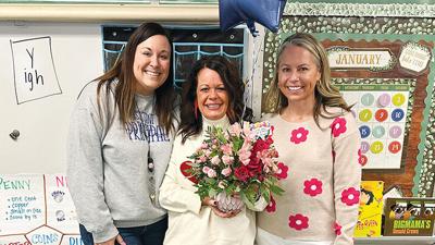 Murphy Elementary assistant principal Lindsay Bartow, left, stands with special education teacher Staci Venatta, center, and principal Gretchen Gorgal.