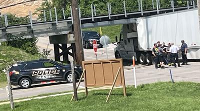 Tractor-trailer gets stuck under railroad trestle in Festus