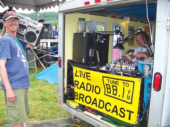 James Mullins, holding a boom box, was one of the KDHX programmers who did a live radio broadcast from Schwagstock at the now defunct Camp Zoe.