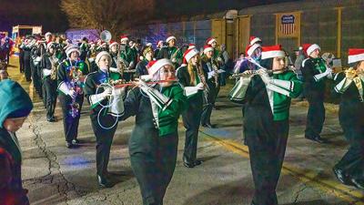 The De Soto High School marching band performs during the De Soto Christmas Parade.
