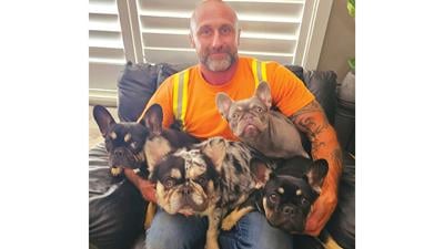 Jefferson County entrepreneur Jeremiah Raber, pictured with his four French bulldogs, is working on a new product after seeing limited success with his Nutshellz cups.