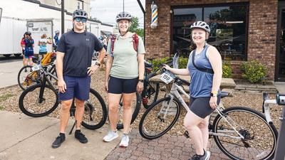 From left, Josh and Haley Finnegan from Arnold and their friend, Helen Ziegler from Festus, ride on the family route in the 2023 Bottleneck Bridge Ride.