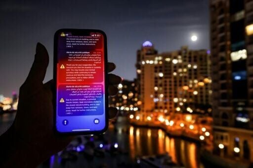 An alert issued by the UAE Ministry of Interior warning residents of Dubai and Abu Dhabi of a potential Iranian missile strike is displayed on a mobile phone shortly before a missile was intercepted on March 5
