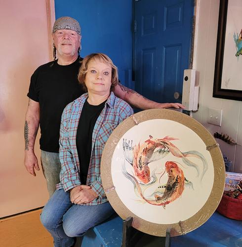 Jerry and Lea Ann Williams of the Hillsboro area with one of the ceramic serving trays Jerry has created. The two are both resident artists at the Green Door Art Gallery in Webster Groves.