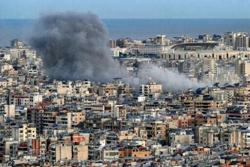 Smoke plumes rise from the site of an Israeli airstrike on Beirut's southern suburbs on March 9