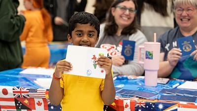 Avik Kalyanam, then 4, of Arnold shows off his passport at the 2024 Fox C-6 Festival of Nations.