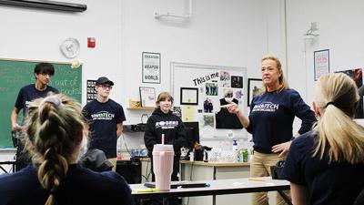 Jenn Werges speaks to students after a group presentation in her junior-year law enforcement class on Jan. 11 at South Technical High School.
