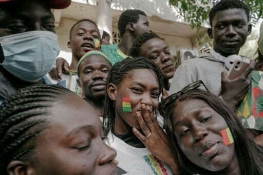 Supporters crowd the streets as Senegal's football team wound through the capital on January 20, 2026