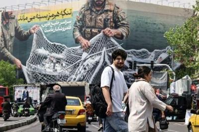 "The Strait of Hormuz remains closed," reads a giant billboard in Tehran