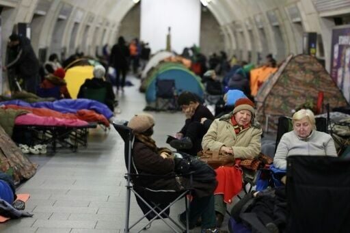 People take shelter at a metro station during Russian air attacks in Kyiv