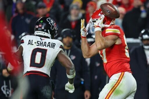 Azeez Al-Shaair of the Houston Texans intercepts a pass intended for Travis Kelce in the Texans' NFL victory over the Kansas City Chiefs