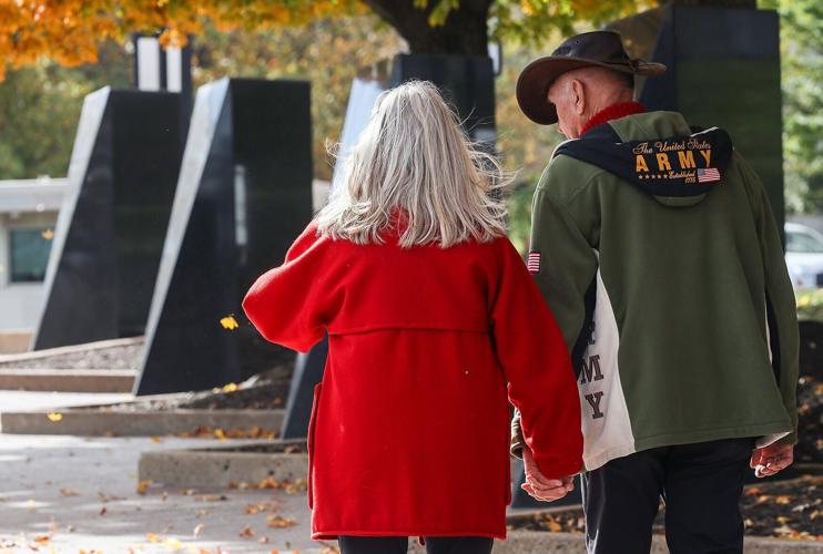 From left, Linda Stratman walks alongside retired Army Maj. Gen. Hank Stratman
