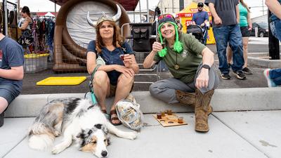 Ester Borner of Affton with her dog Stanley and friend Judi Spalding of Barnhart sample mead at the annual Sigurblot Viking Festival in downtown Festus.