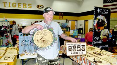 Vendor Joe Lusk of Barnhart holds up some of his creations.