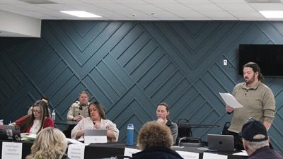 Peaceful Village Board of Trustees member Daniel Ross III reads aloud one of his proposed bills during a Feb. 14 special meeting.