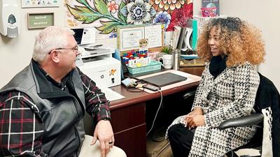 Dunklin R-5 School District Superintendent Clint Freeman meets with Kayla Crawford, a school-based clinician from Chestnut Health Systems.