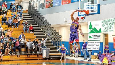 Harlem Wizards player “Leon Space Jam” dunks the ball during the 2022 event at Northwest High School in Cedar Hill.