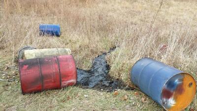 Some of the barrels filled with oil that were dumped at the Young Conservation Area in Jefferson County near the city of Eureka.
