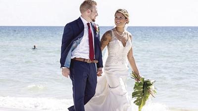 Creve Coeur Police Officer Cambra Pogue-Tucker, formerly of Arnold, wore a free dress from the Bridal Shoppe for her October 2021 Florida beach wedding to Derek Tucker.