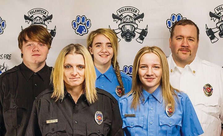 The family of volunteer firefighters – from left, Garrett, Jamie, Paige, Sklyer and David Hoffmann – worked to put out a 20-acre brush fire in February.
