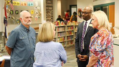 Rockwood School District Superintendent Curtis Cain and Board of Education vice president Lynne Midyett, right, meet with members of the Rockwood community in LaSalle Springs Middle School.
